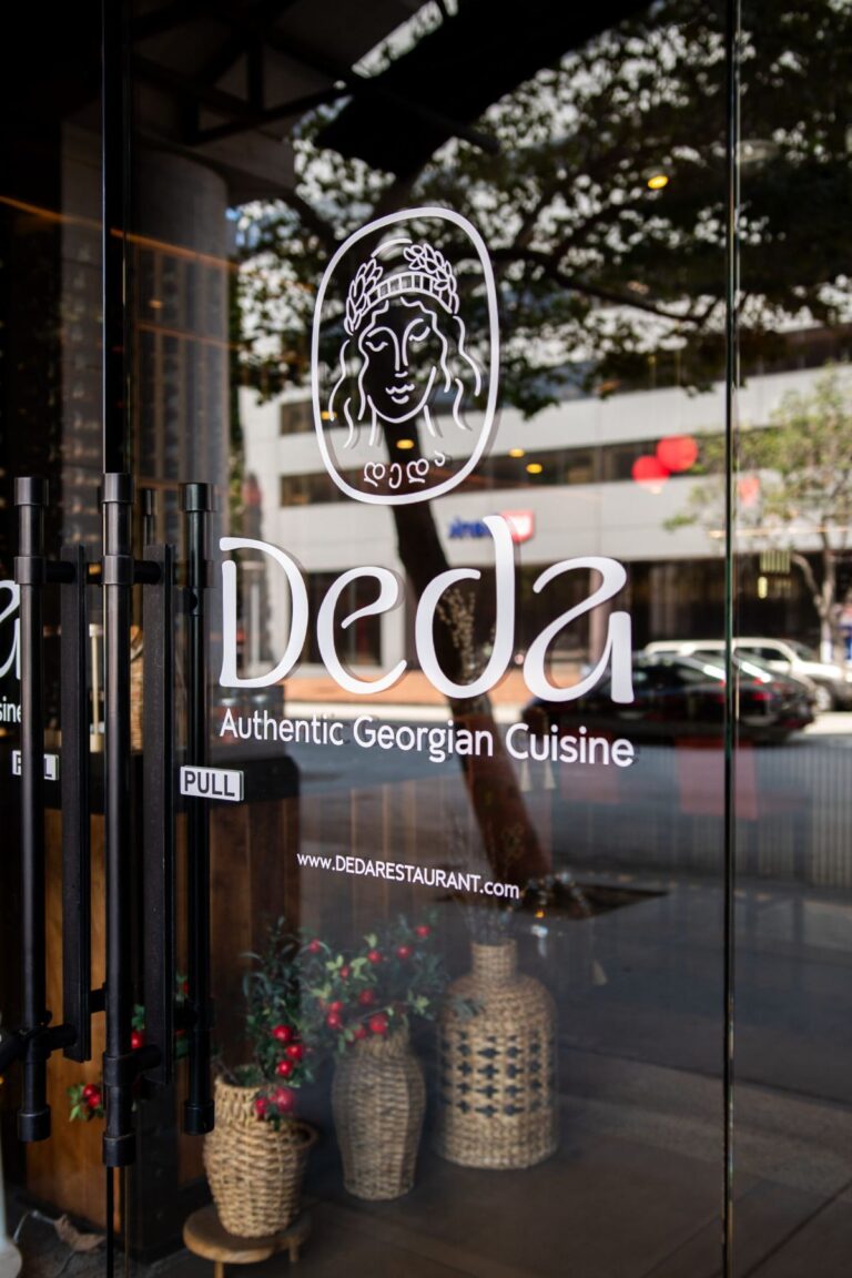 Restaurant entrance with the Deda Authentic Georgian Cuisine logo on the glass