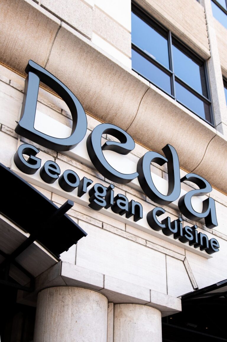 The Deda Georgian Cuisine sign on the building facade